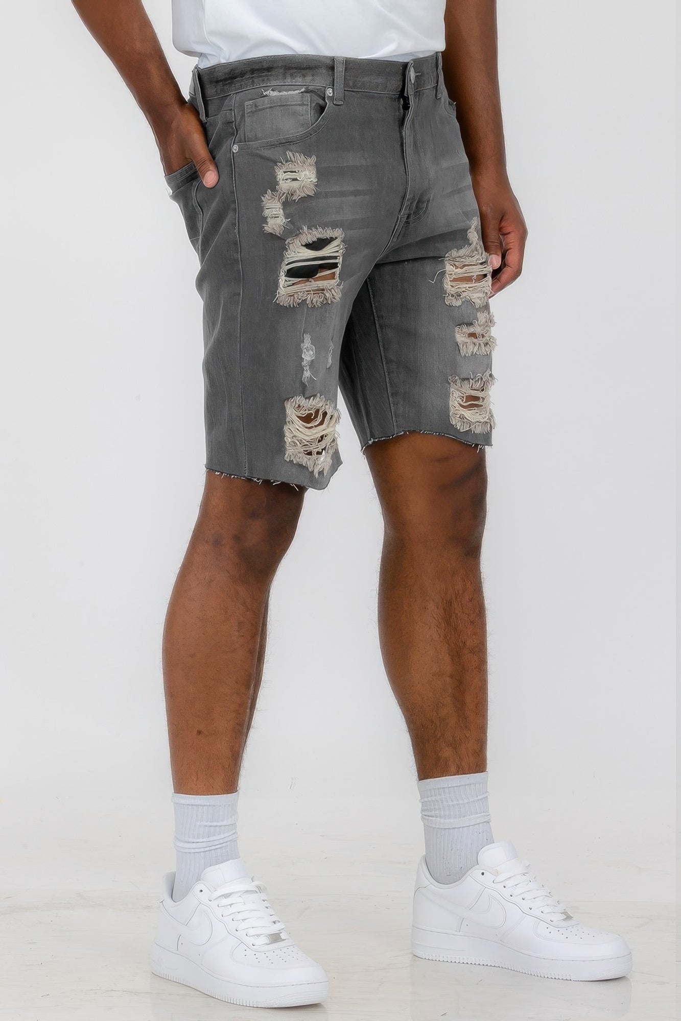 Golden Heir distressed stretch denim shorts in black, featuring a casual fit and frayed hem, suitable for everyday wear.