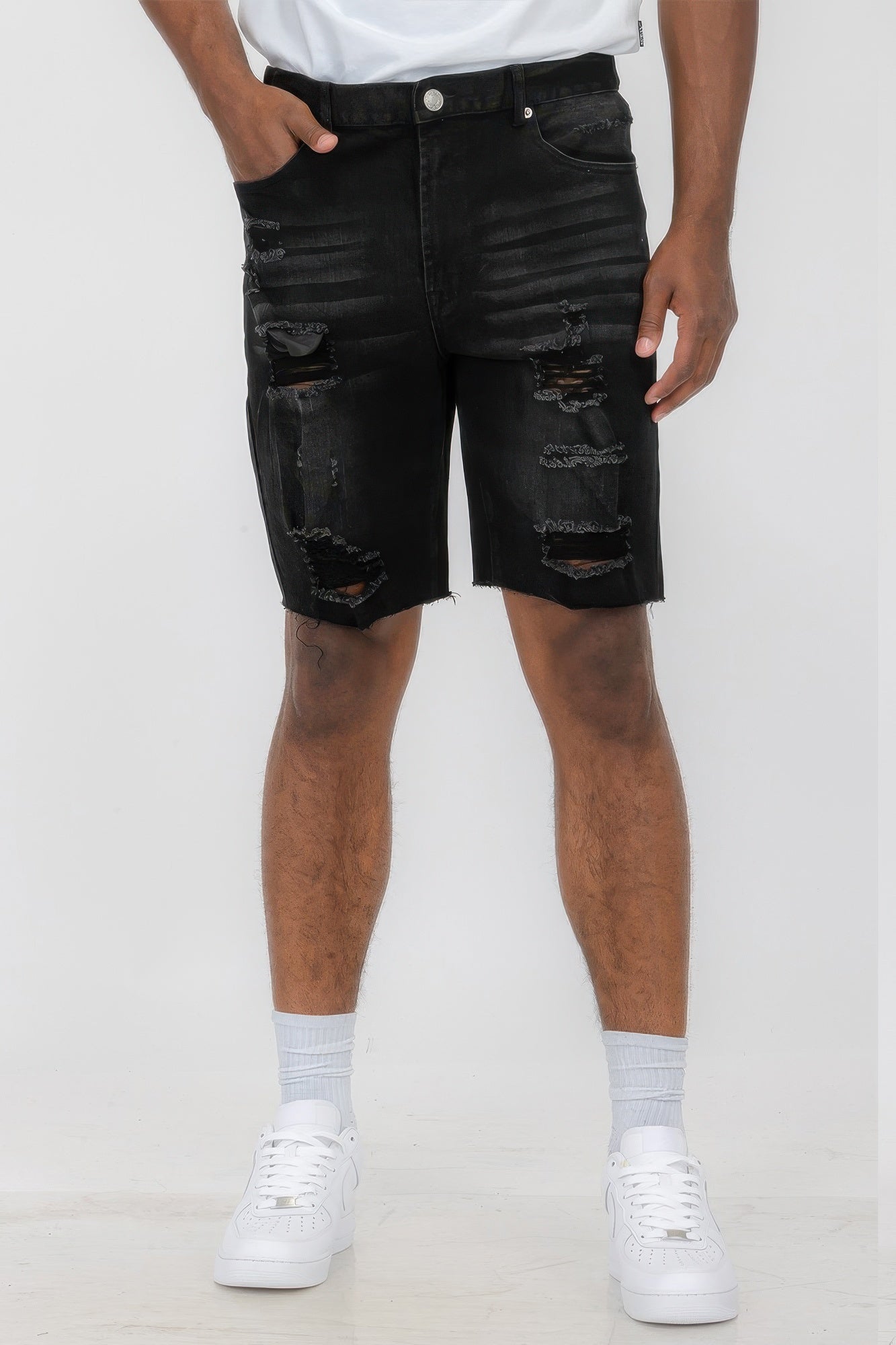 Golden Heir distressed stretch denim shorts in black, featuring a fitted design and frayed hem, casual summer fashion.