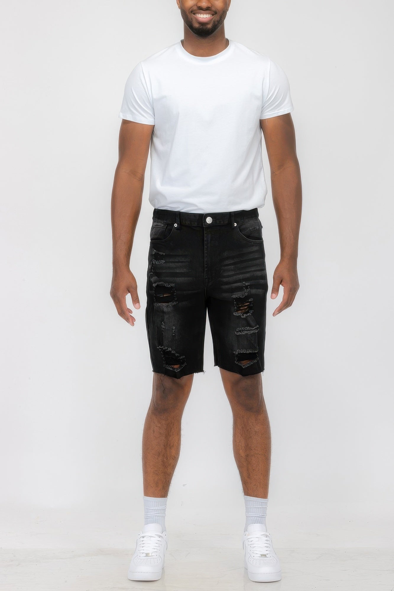 Golden Heir distressed stretch denim shorts in black, featuring a casual fit and frayed hem for a trendy summer look.