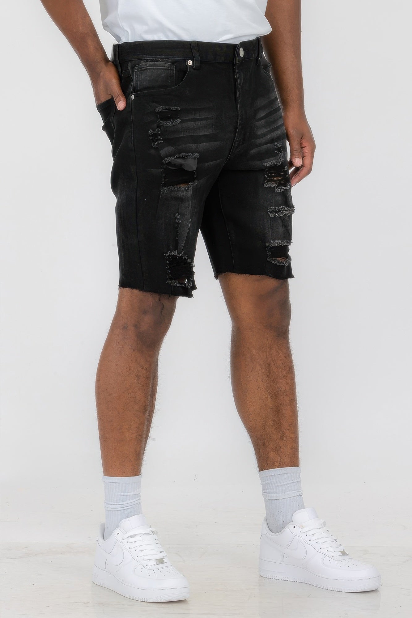 Golden Heir distressed stretch denim shorts in black, featuring a casual fit and frayed hem for a trendy summer look.