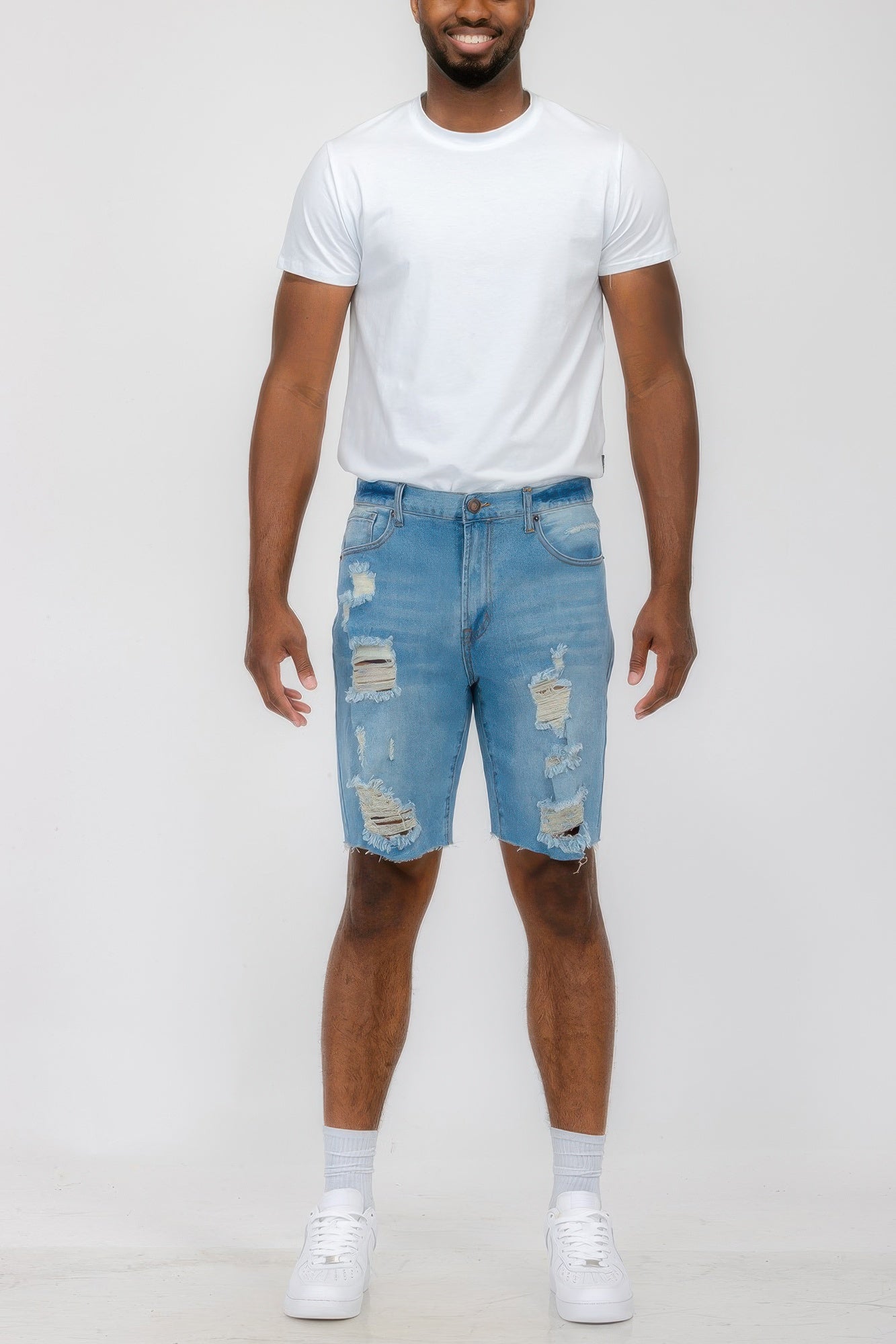 Golden Heir distressed stretch denim shorts in black, featuring a casual fit and frayed hem for a trendy summer look.