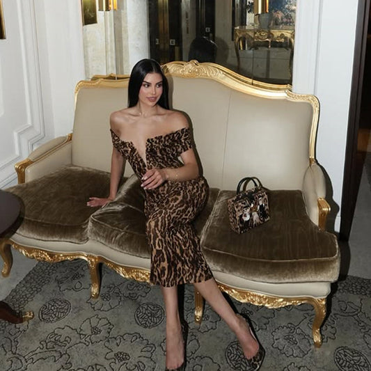 Golden Heir women's leopard-print evening gown with off-shoulder design and V-neck, featuring a fitted silhouette and elegant style.