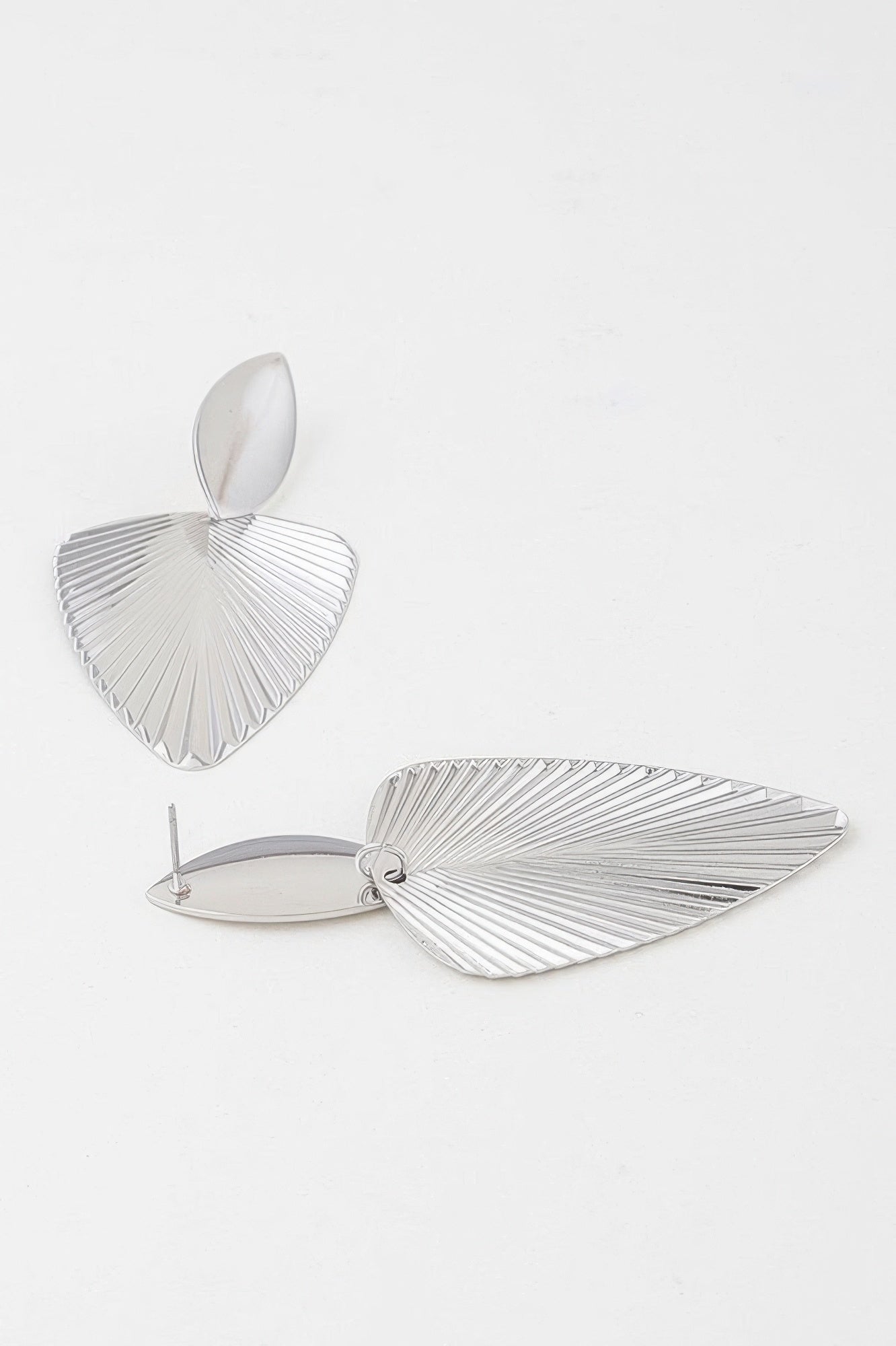 Golden Heir modern ribbed leaf drop earrings in gold, featuring a sleek, elegant design with leaf-shaped dangles.