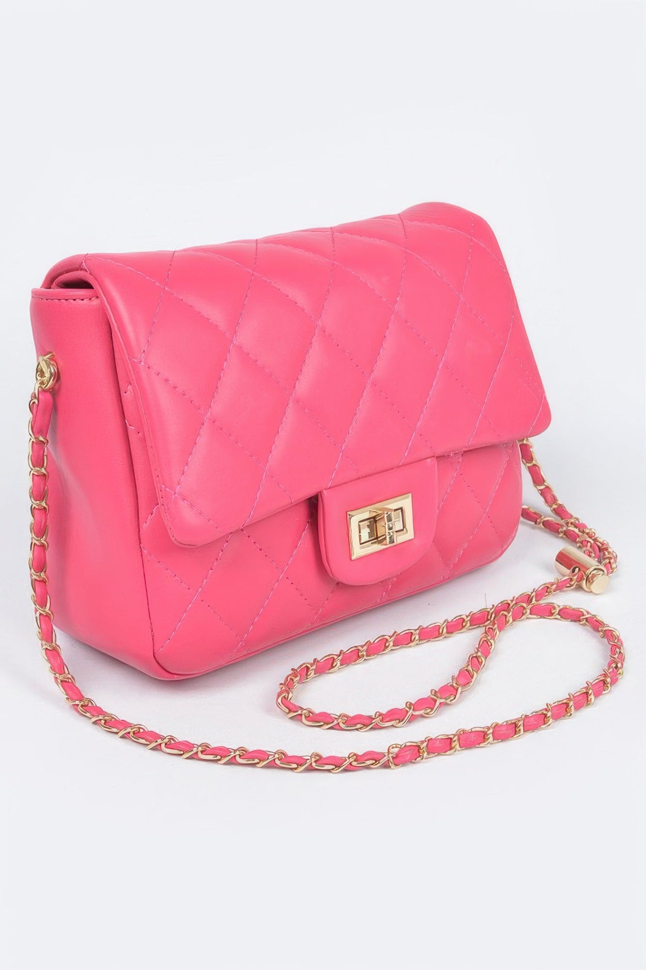 Golden Heir quilted faux leather flap bag in nude color with gold-tone hardware and a stylish design.