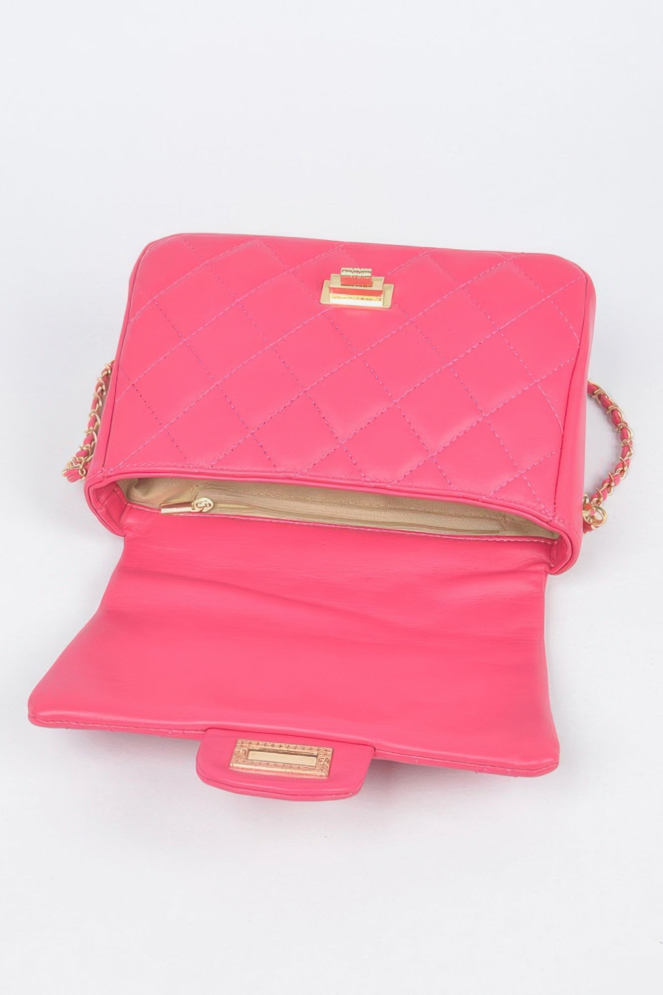 Golden Heir quilted faux leather flap bag in nude color with gold-tone hardware and a stylish design.