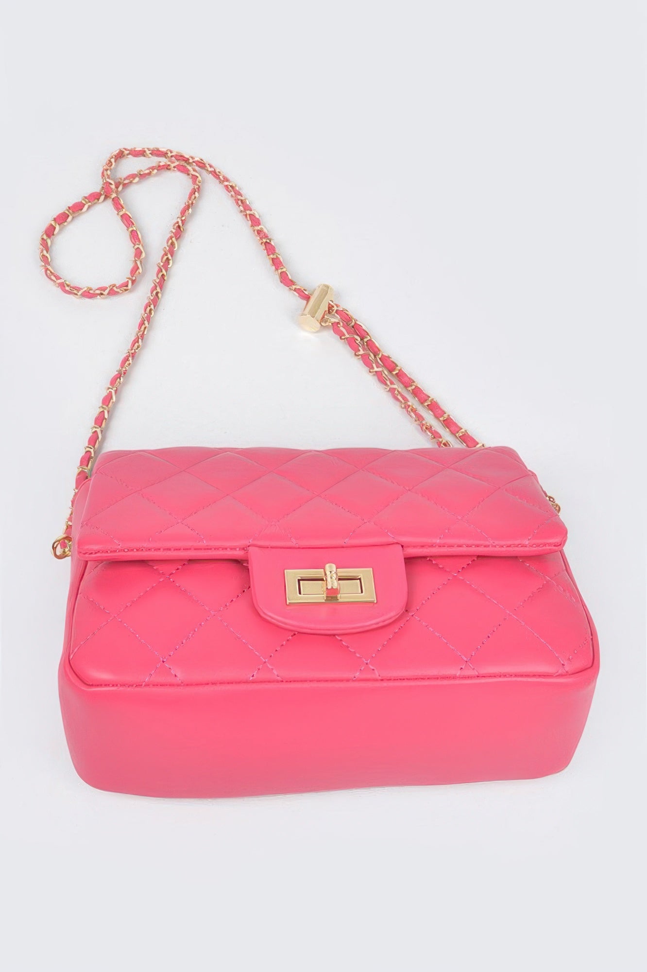 Golden Heir quilted faux leather flap bag in nude color with gold-tone hardware and a stylish design.