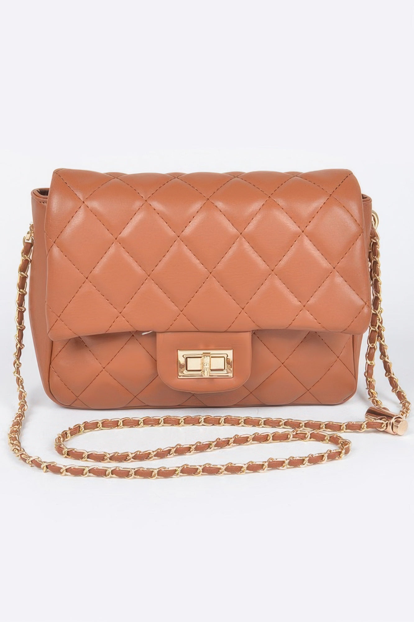 Golden Heir quilted faux leather flap bag in nude color with gold-tone hardware and structured design.