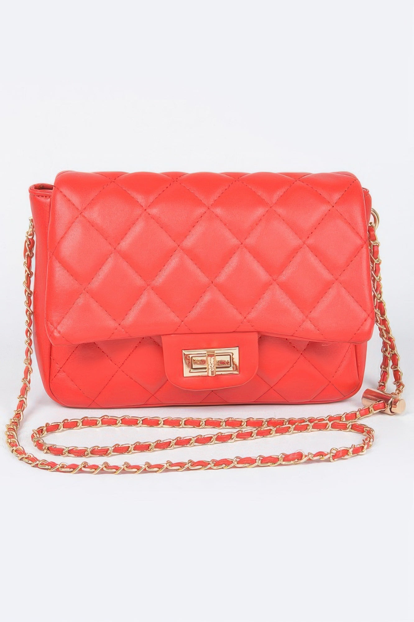 Golden Heir quilted faux leather flap bag in nude color with gold-tone hardware and a stylish design.