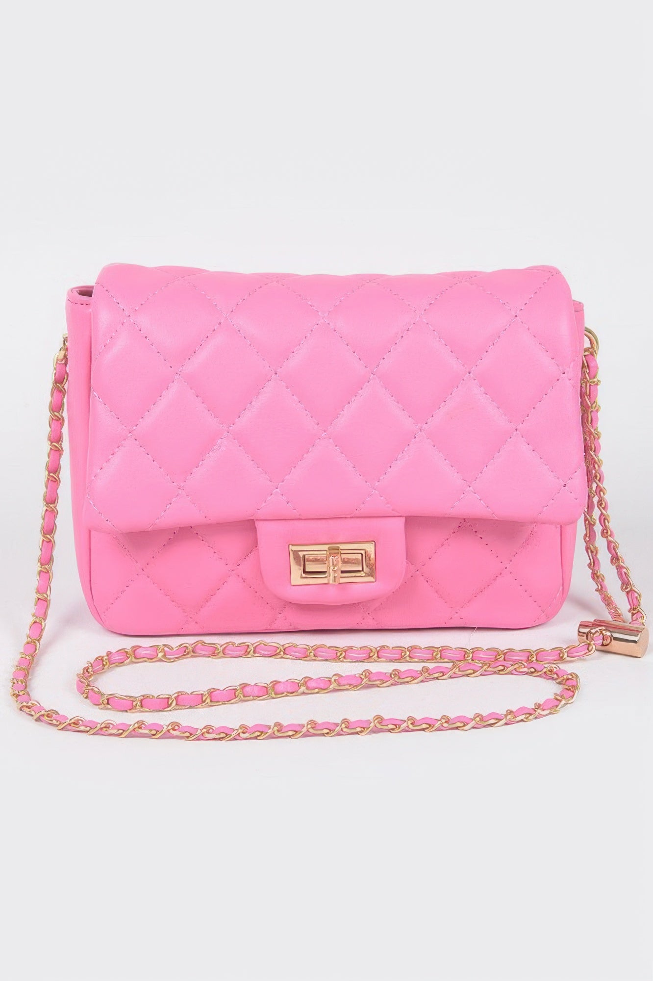 Golden Heir quilted faux leather flap bag in nude color with gold-tone hardware and a sleek, stylish design.