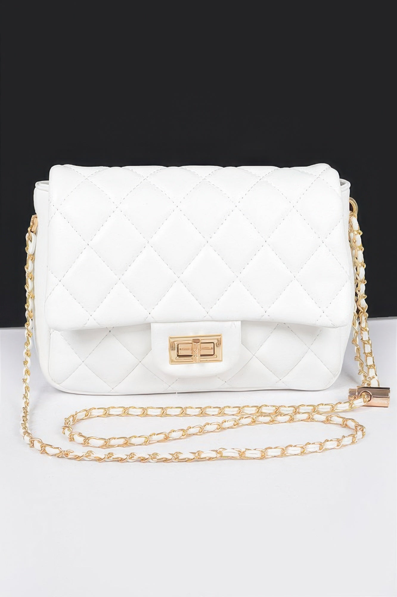 Golden Heir quilted faux leather flap bag in nude color with gold-tone hardware, featuring a stylish design and front flap closure.