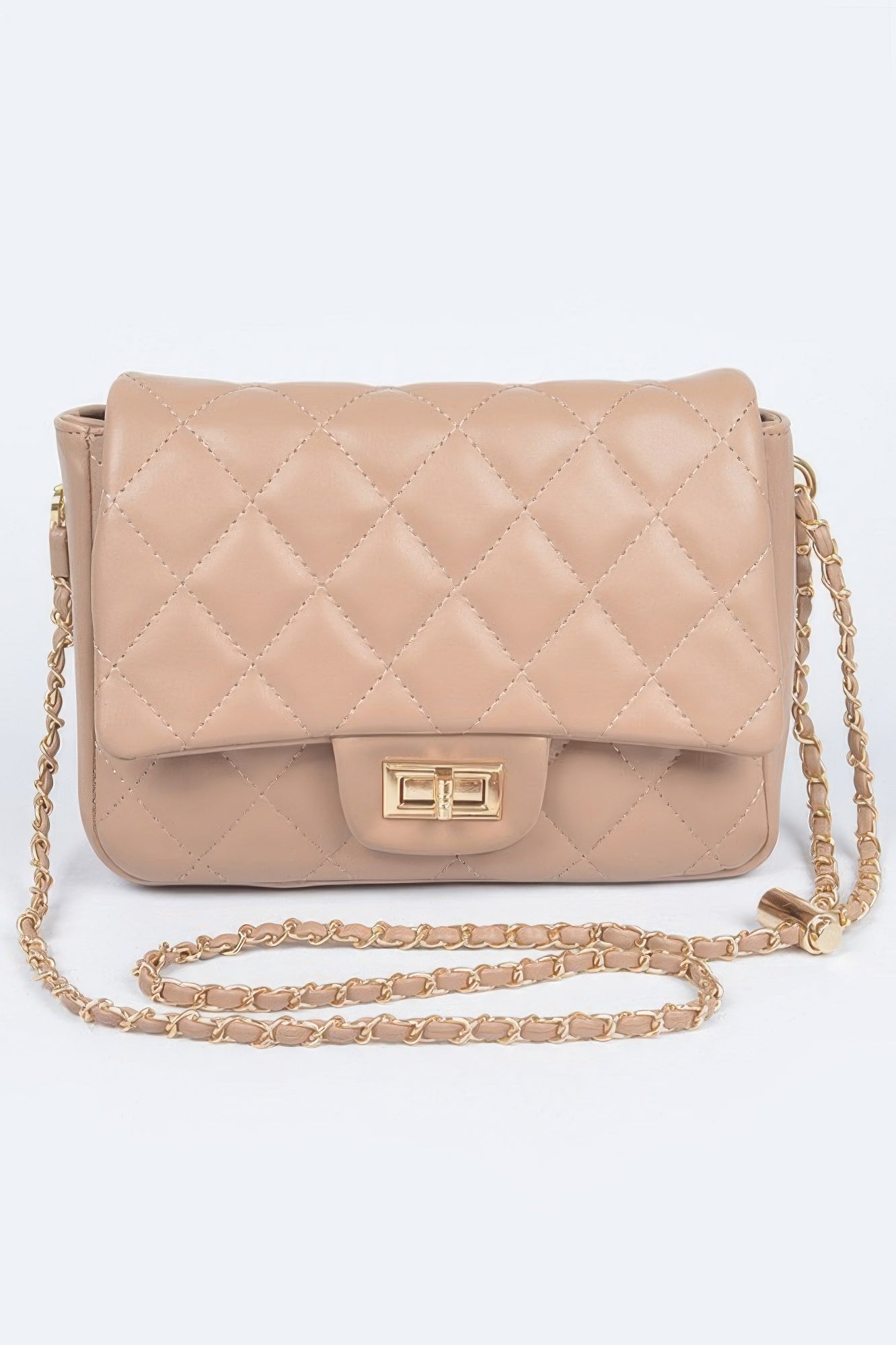 Golden Heir quilted faux leather flap bag in nude color, featuring a stylish design with a top flap closure and gold-tone accents.