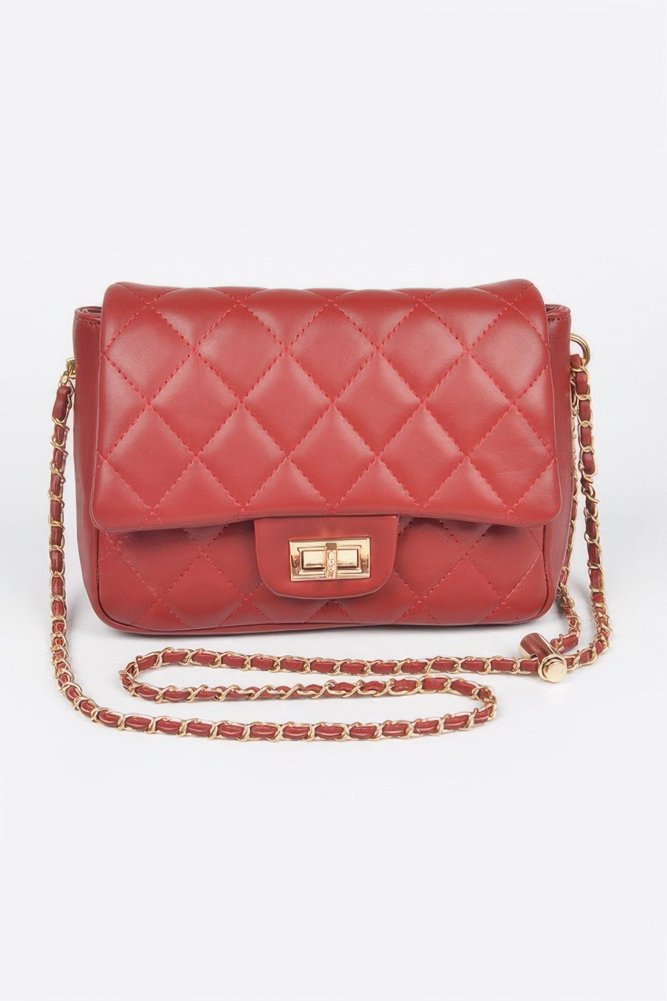 Golden Heir quilted faux leather flap bag in nude color with gold-tone hardware and a classic design.