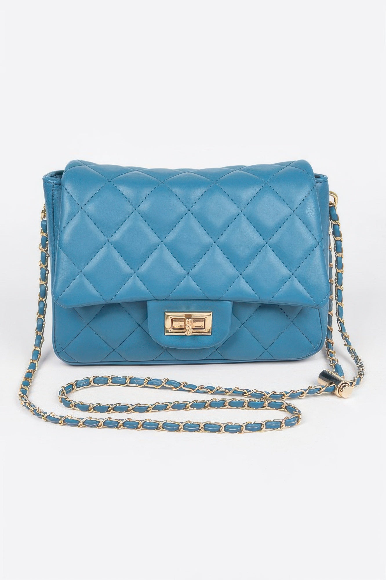 Golden Heir quilted faux leather flap bag in nude with gold accents, featuring a stylish design and elegant flap closure.