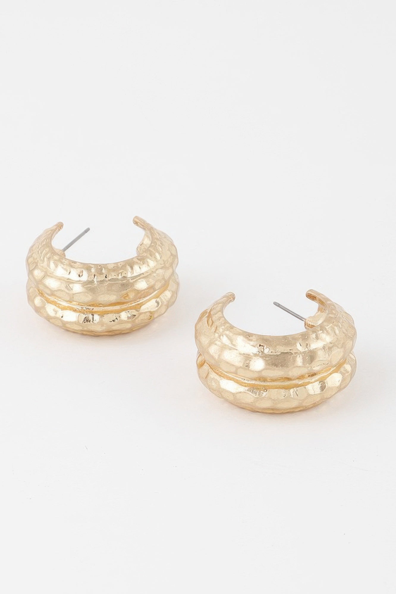 Golden Heir double hammered gold hoop earrings, drop earrings style with a shiny, textured finish, hanging elegantly.