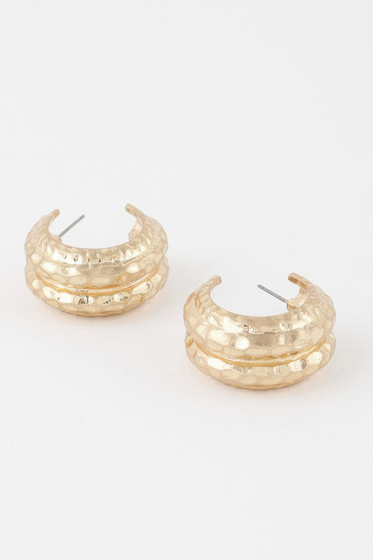 Golden Heir double hammered gold hoop earrings, drop earrings style with a shiny, textured finish, hanging elegantly.