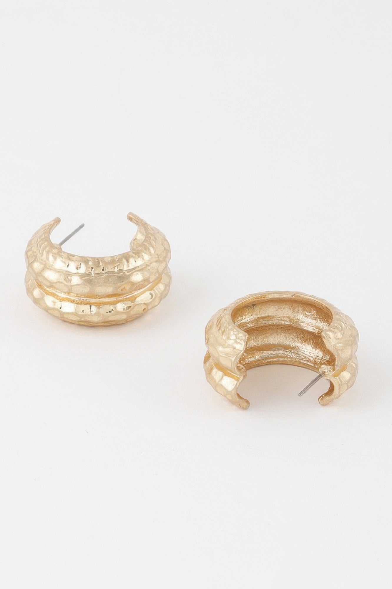 Golden Heir double hammered gold hoop earrings, drop earring style with a shiny, textured finish.