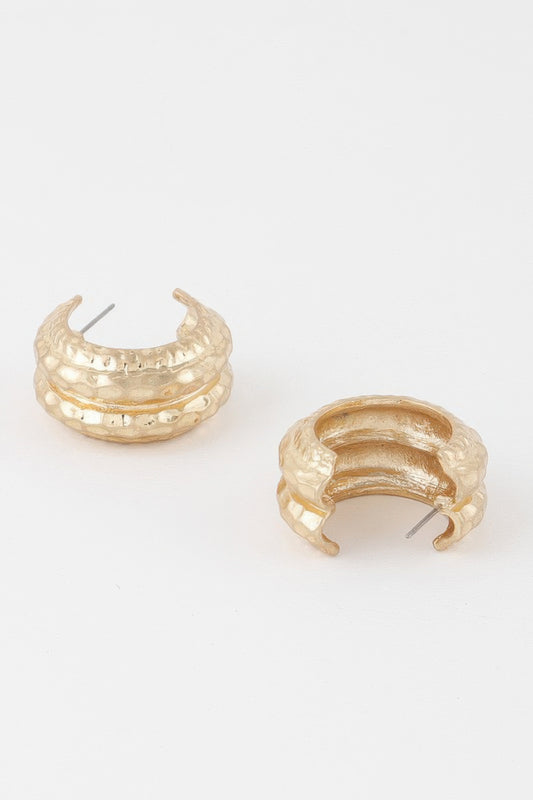 Golden Heir double hammered gold hoop earrings, drop earring style with a shiny, textured finish.