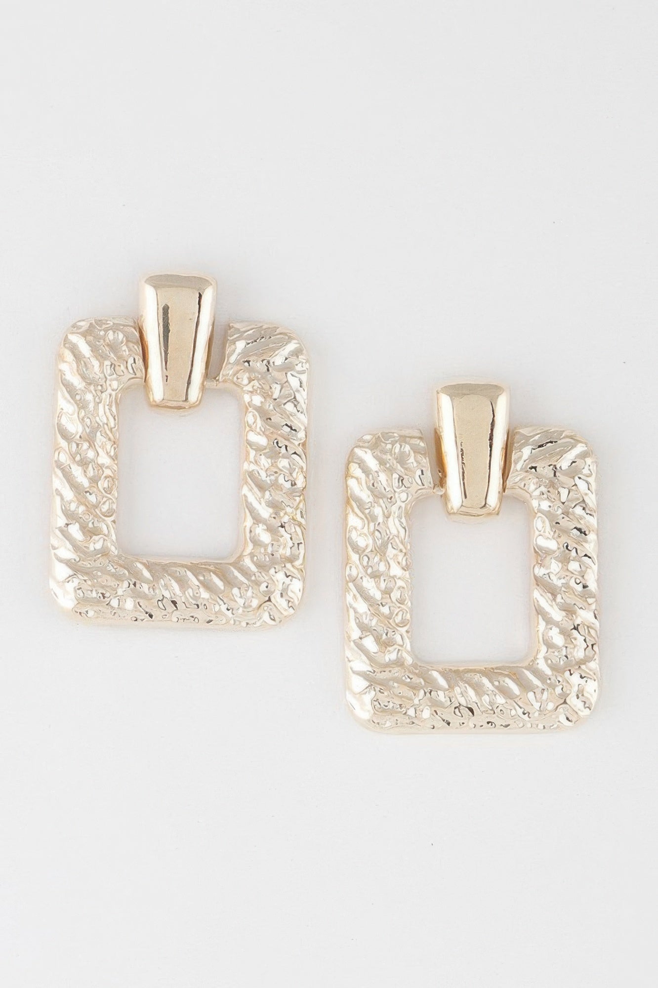 Golden Heir multi-shape gold arch drop earrings featuring various geometric designs, stylish and elegant accessory for any outfit.