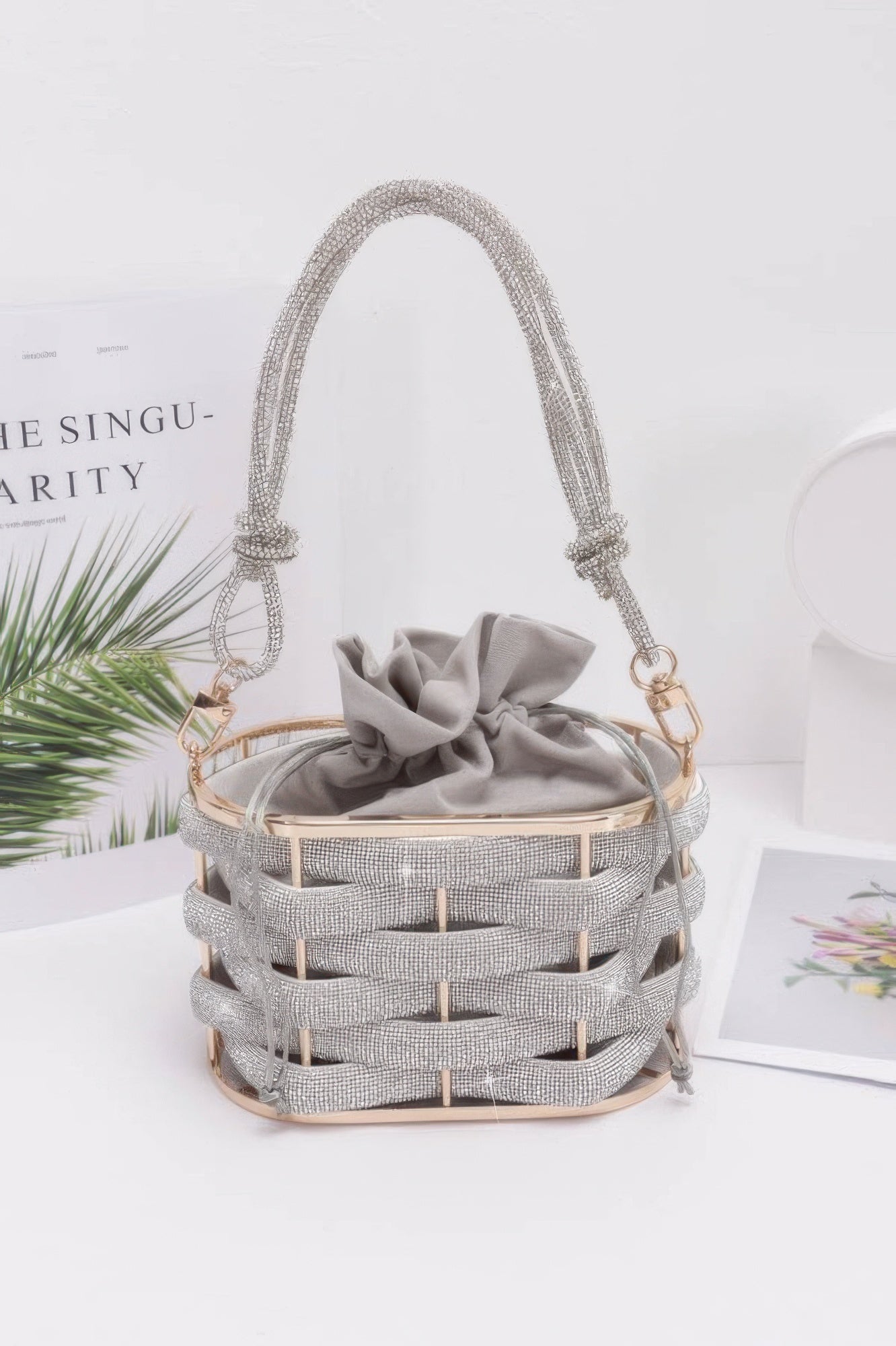 Golden Heir crystal braided metal bucket handbag with black accents, stylish and compact for everyday use.