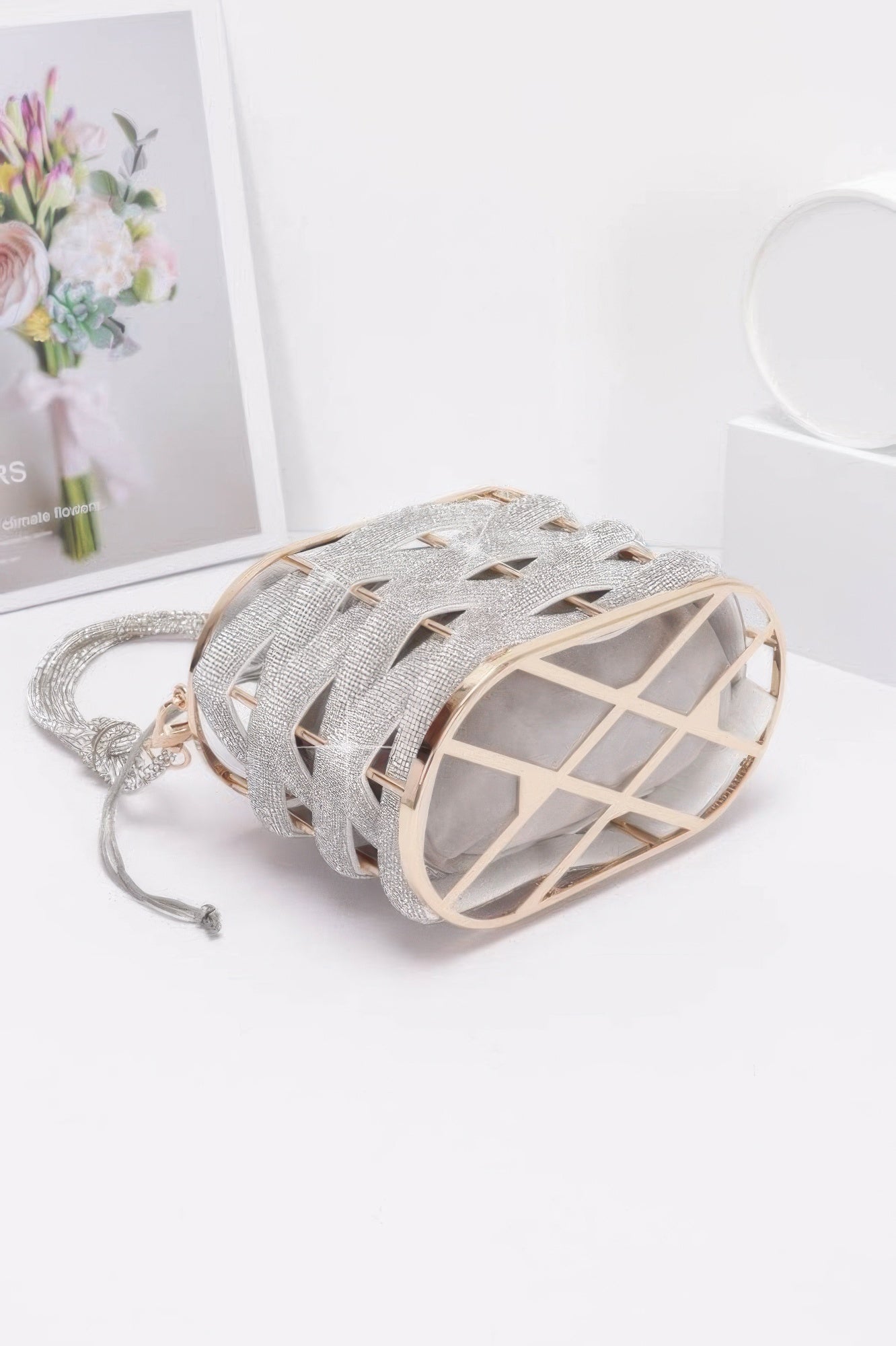 Golden Heir crystal braided metal bucket handbag with gold accents, featuring a stylish black design and intricate detailing.