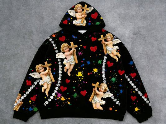 Black men's hooded sweatshirt with a Little Angel print by Golden Heir, featuring a comfortable fit and detailed graphic design.