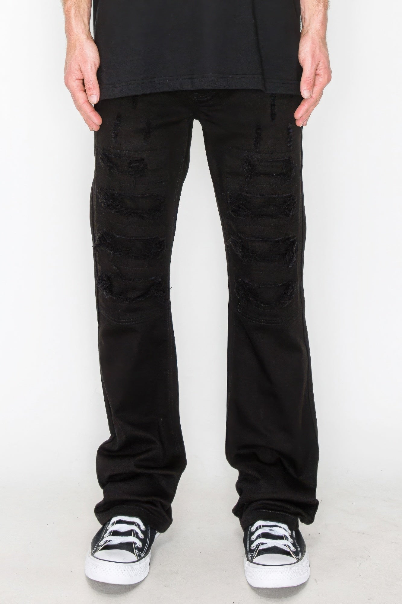 Golden Heir bootcut jeans with rip and repair details in vibrant colored denim, showcasing distressed style and relaxed fit.