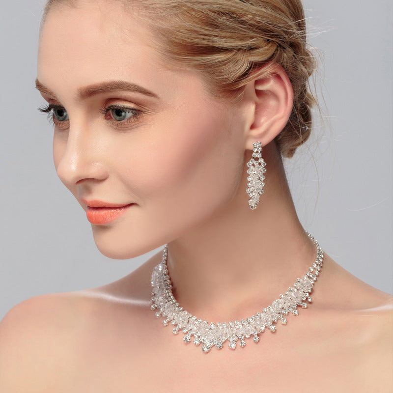 Golden Heir wedding jewelry set featuring a gold crown, necklace, and earrings for bridal special occasion.
