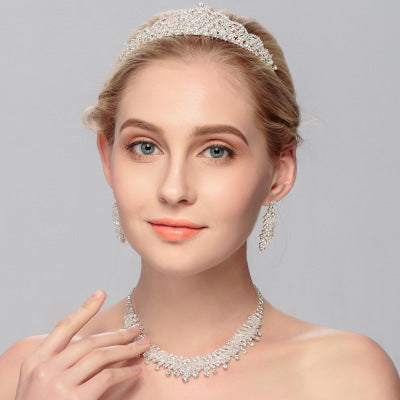 Golden Heir wedding jewelry set featuring a gold crown and matching jewelry for bridal or special occasions.