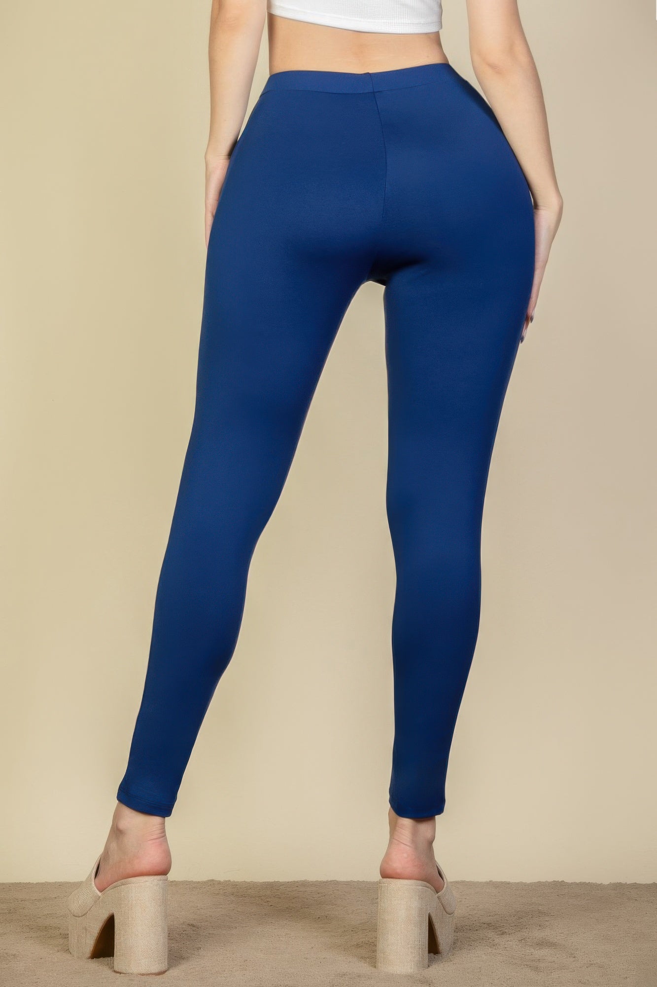 Black solid high waist leggings by Golden Heir, stretchy and fitted, shown on a model.