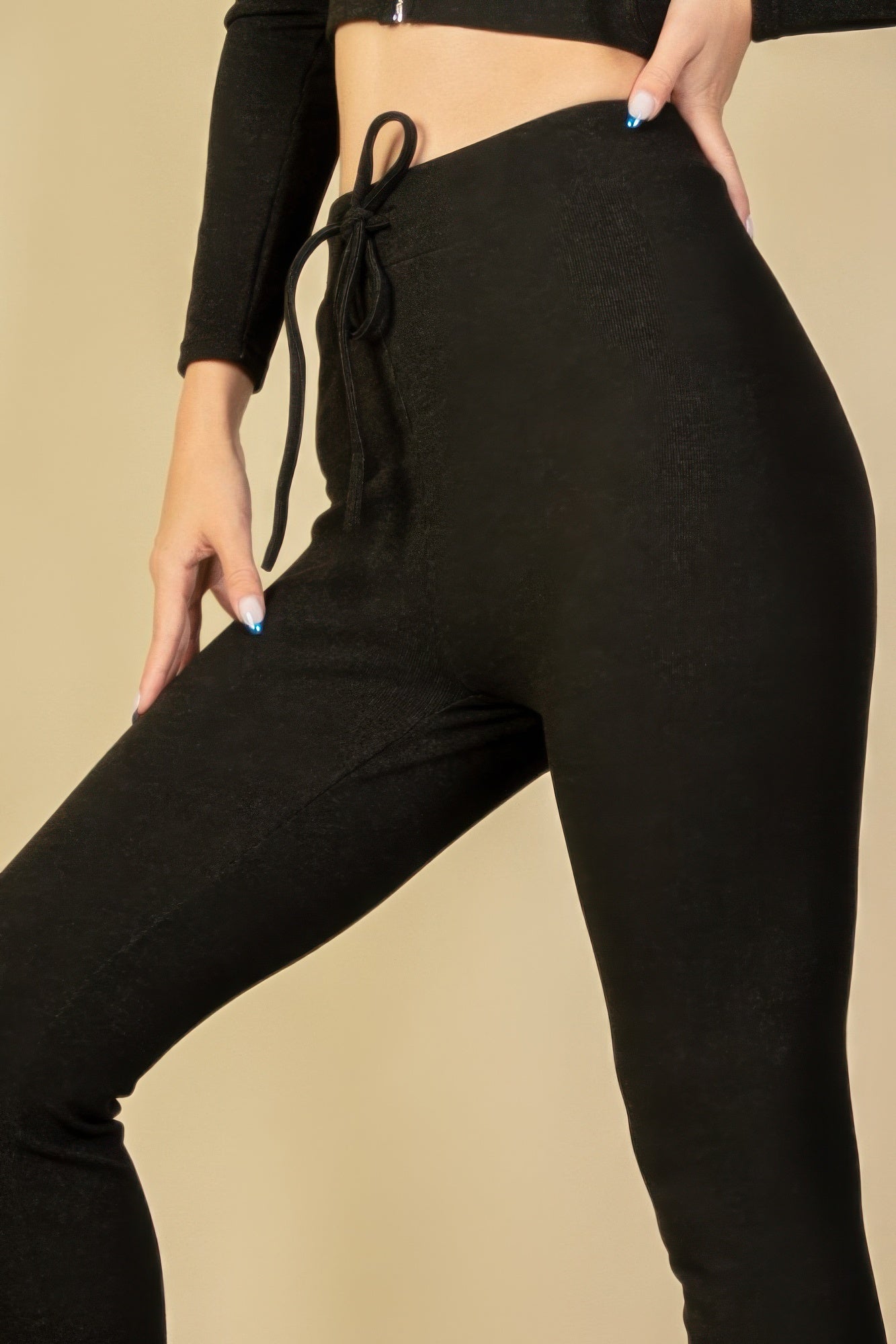 Black Golden Heir tie-front ribbed lounge leggings shown on model, showcasing comfortable fit and stylish ribbed texture.