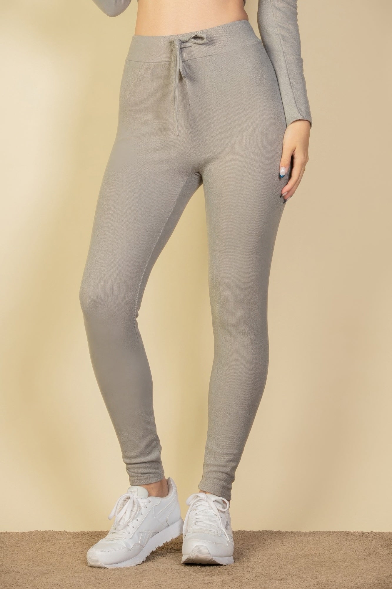Black Golden Heir tie-front ribbed lounge leggings, close-up of comfortable, stretchy fabric with tie-front detail.