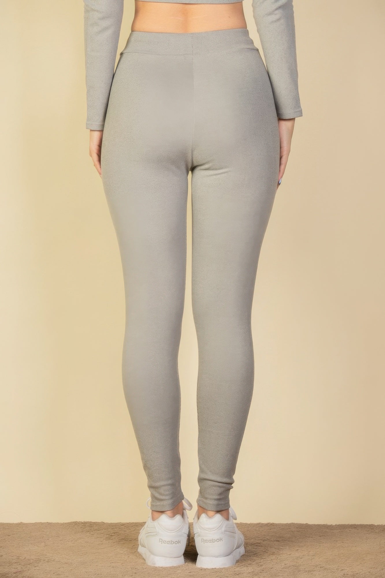 Black Golden Heir tie-front ribbed lounge leggings shown on a model, featuring a comfortable fit and textured ribbed fabric.