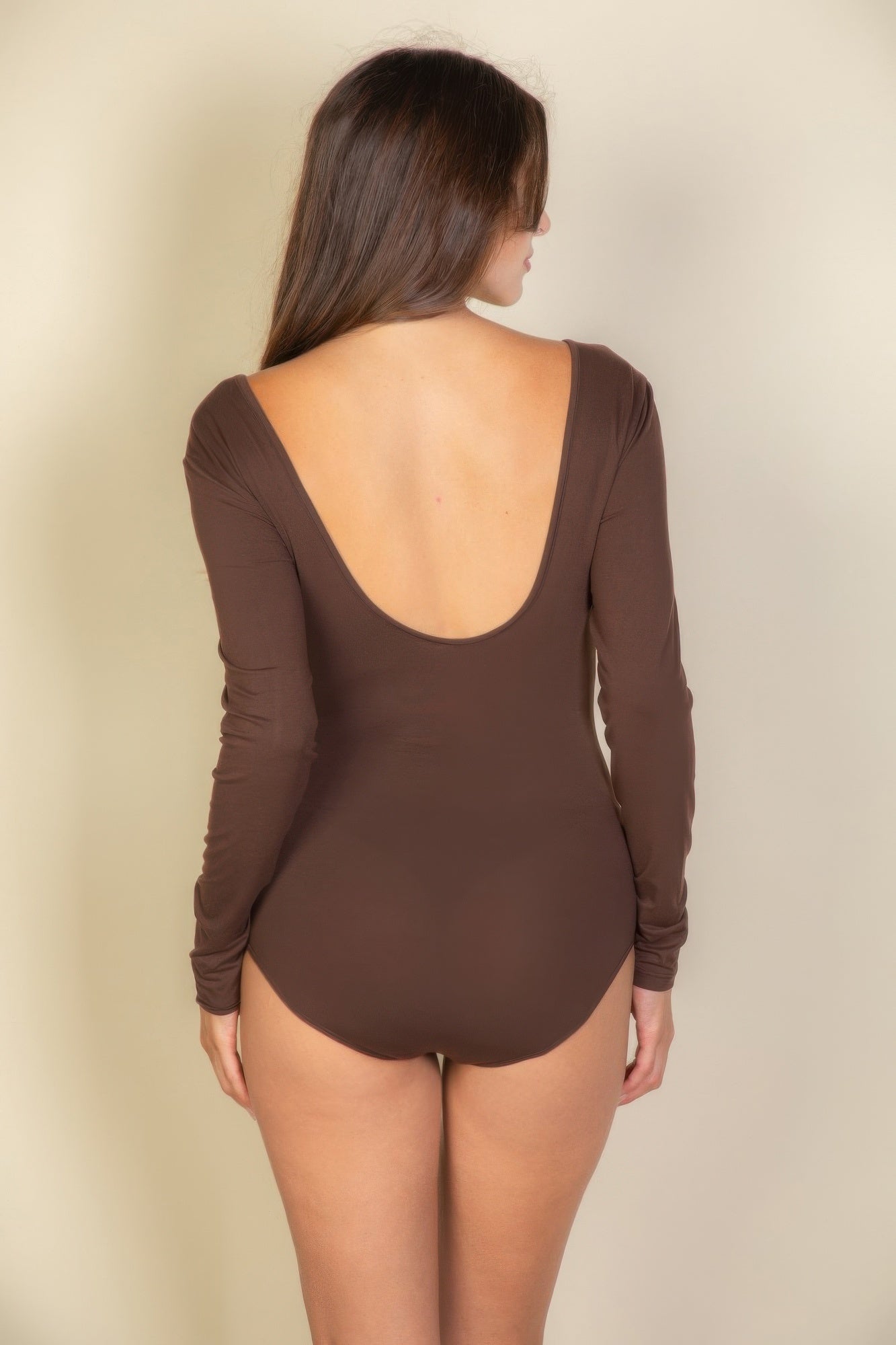 Black Golden Heir long sleeve scoop neck bodysuit displayed flat, showing the fitted design and smooth fabric.