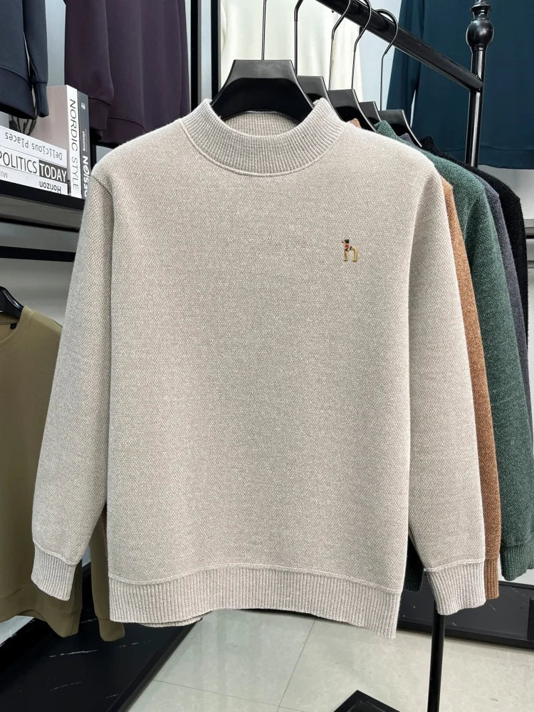 Beige Golden Heir men's long sleeve crewneck top, close-up of the soft fabric and classic fit, featuring the brand's logo on the chest.