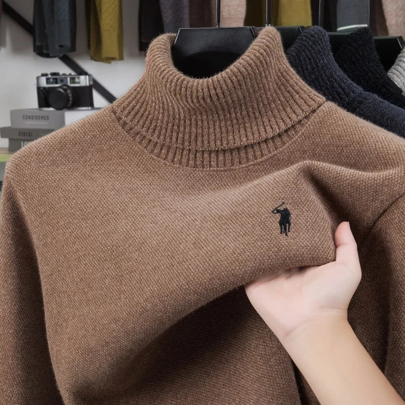 Black Golden Heir men's long sleeve top with a sleek, elevated design and subtle branding, shown on a mannequin.
