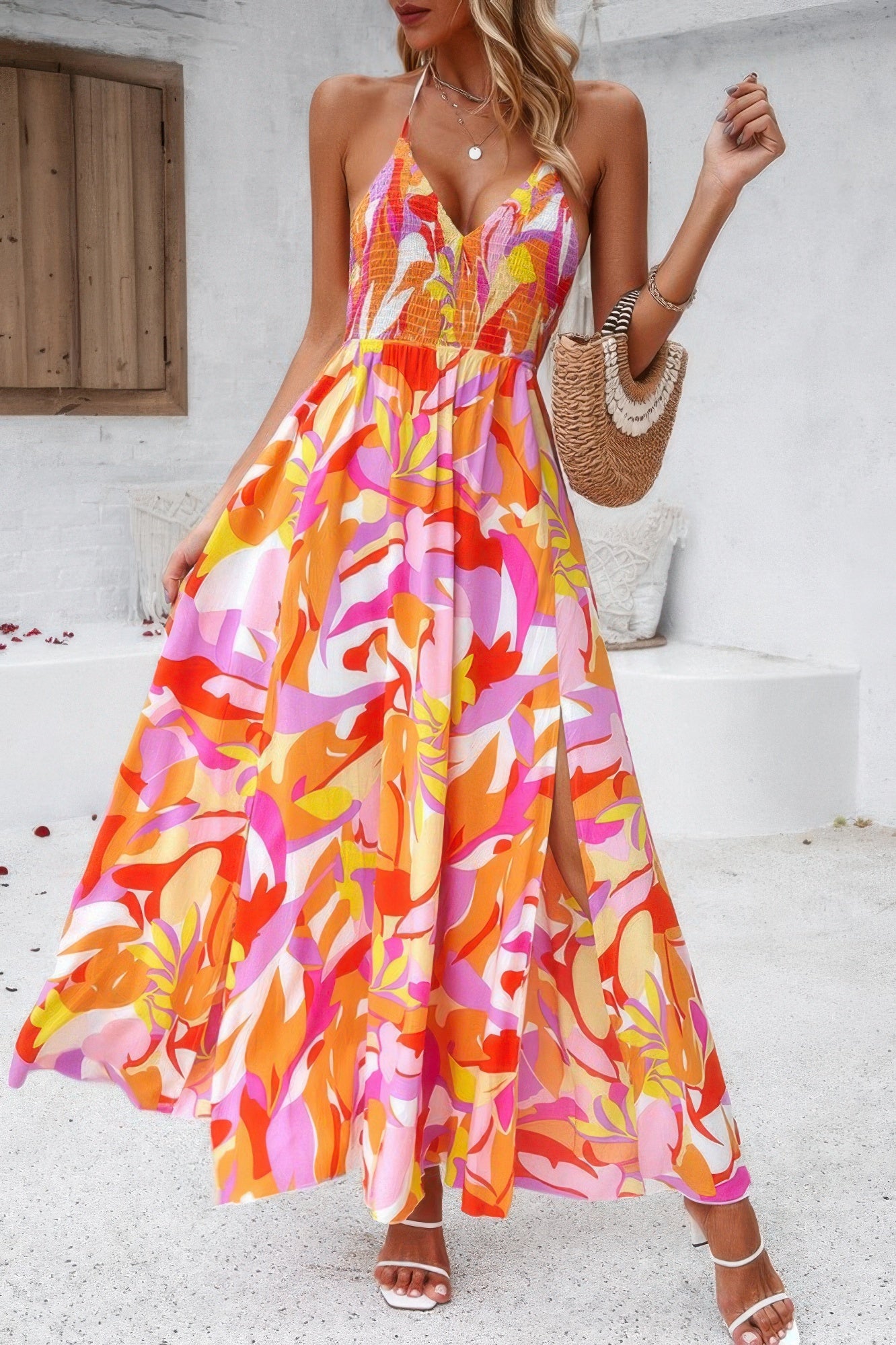 Golden Heir floral boho sleeveless maxi dress with high waist and tie detail, featuring a vibrant blue and gold pattern.