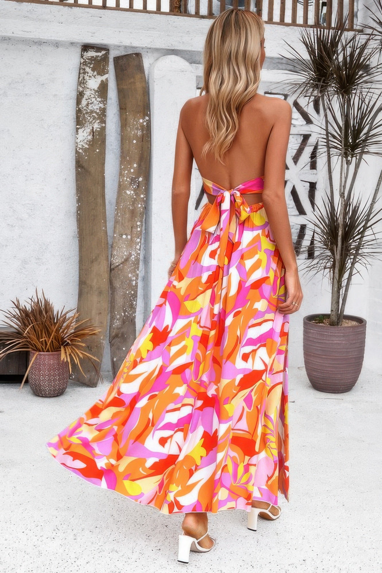 Golden Heir floral boho sleeveless maxi dress with tie waist, high-waist design and vibrant blue and gold pattern.