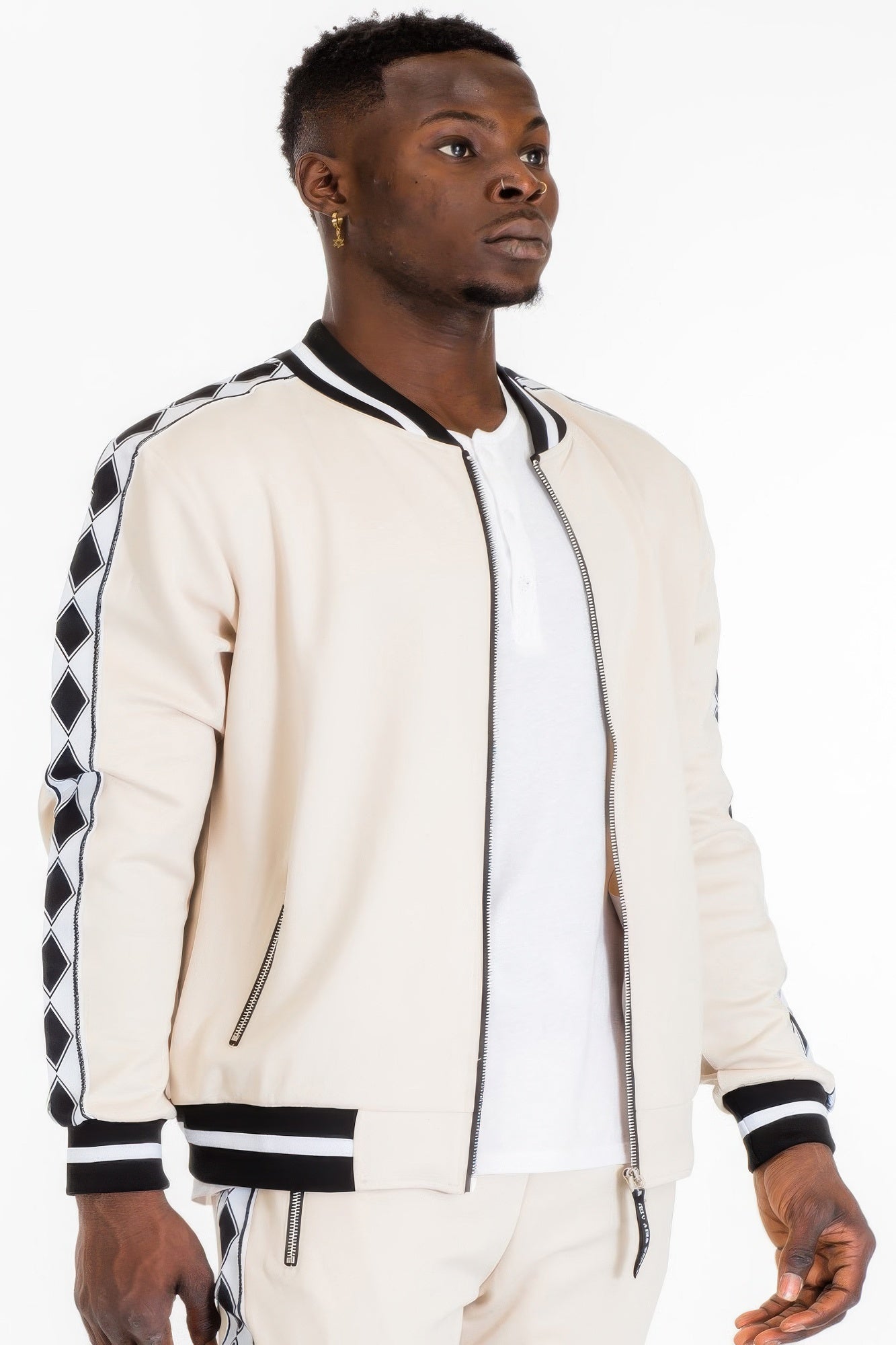 Golden Heir men's track set with black fabric and diamond tape accents, featuring a sporty athletic design.