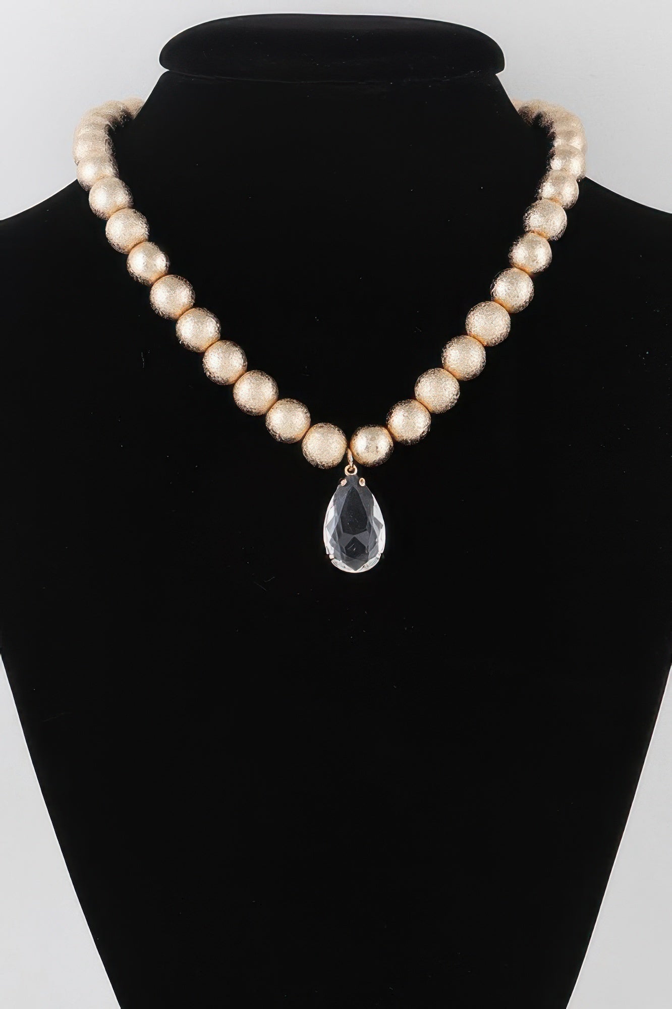 Golden Heir clear teardrop beaded necklace featuring gold accents, elegant and stylish jewelry for special occasions.