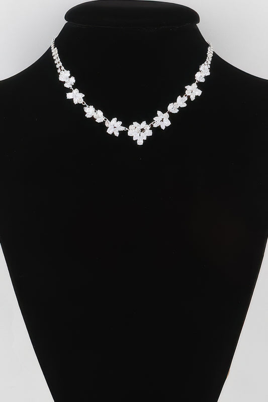 Golden Heir crystal flower charm necklace with a gold chain and clear gemstone pendant, elegant jewelry for special occasions.