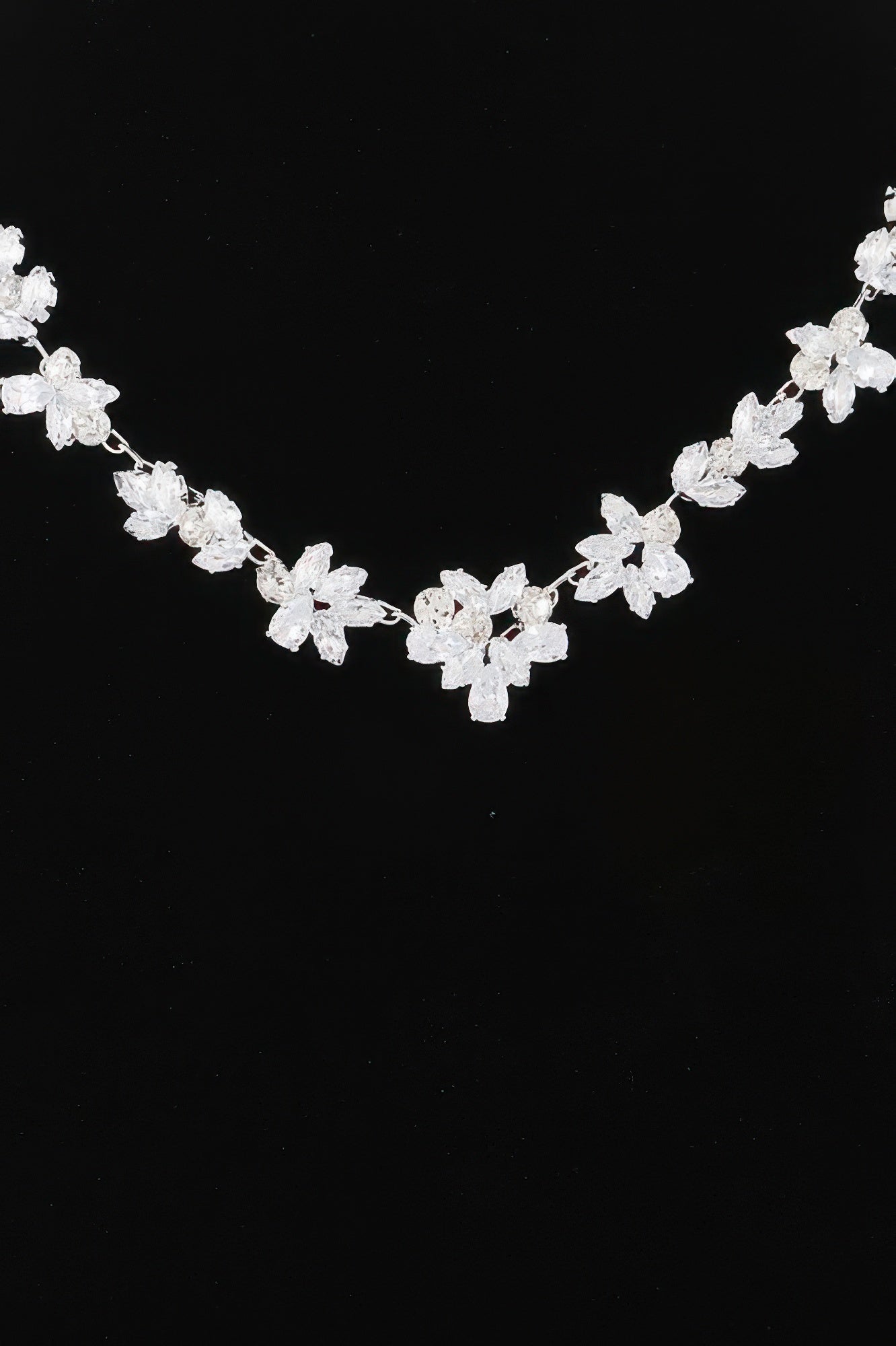Golden Heir crystal flower charm necklace featuring a gold chain and clear crystal flower pendant.