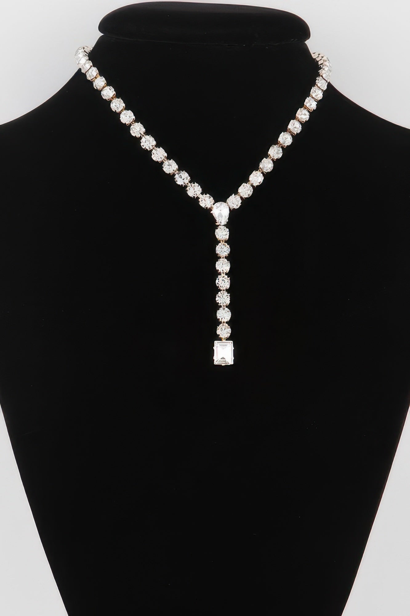 Golden Heir dipped gold Y-shaped necklace with clear accents, showcasing elegant jewelry design.
