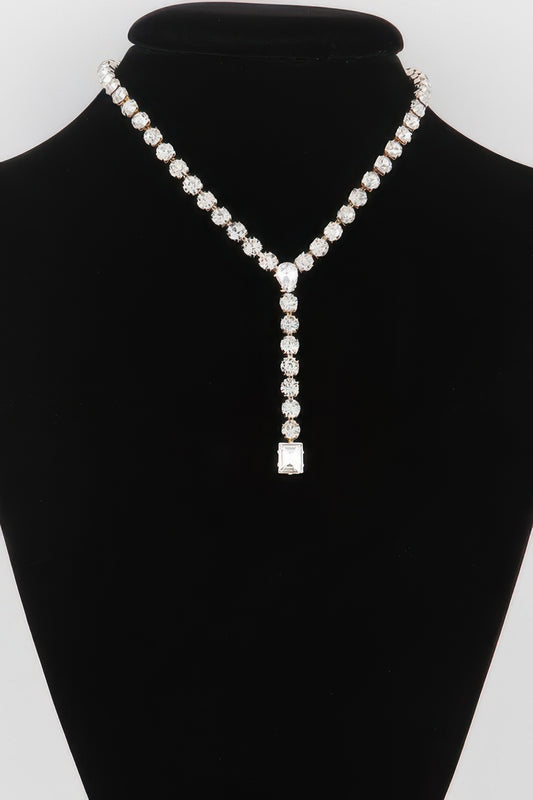 Golden Heir dipped gold Y-shaped necklace with clear accents, showcasing elegant jewelry design.