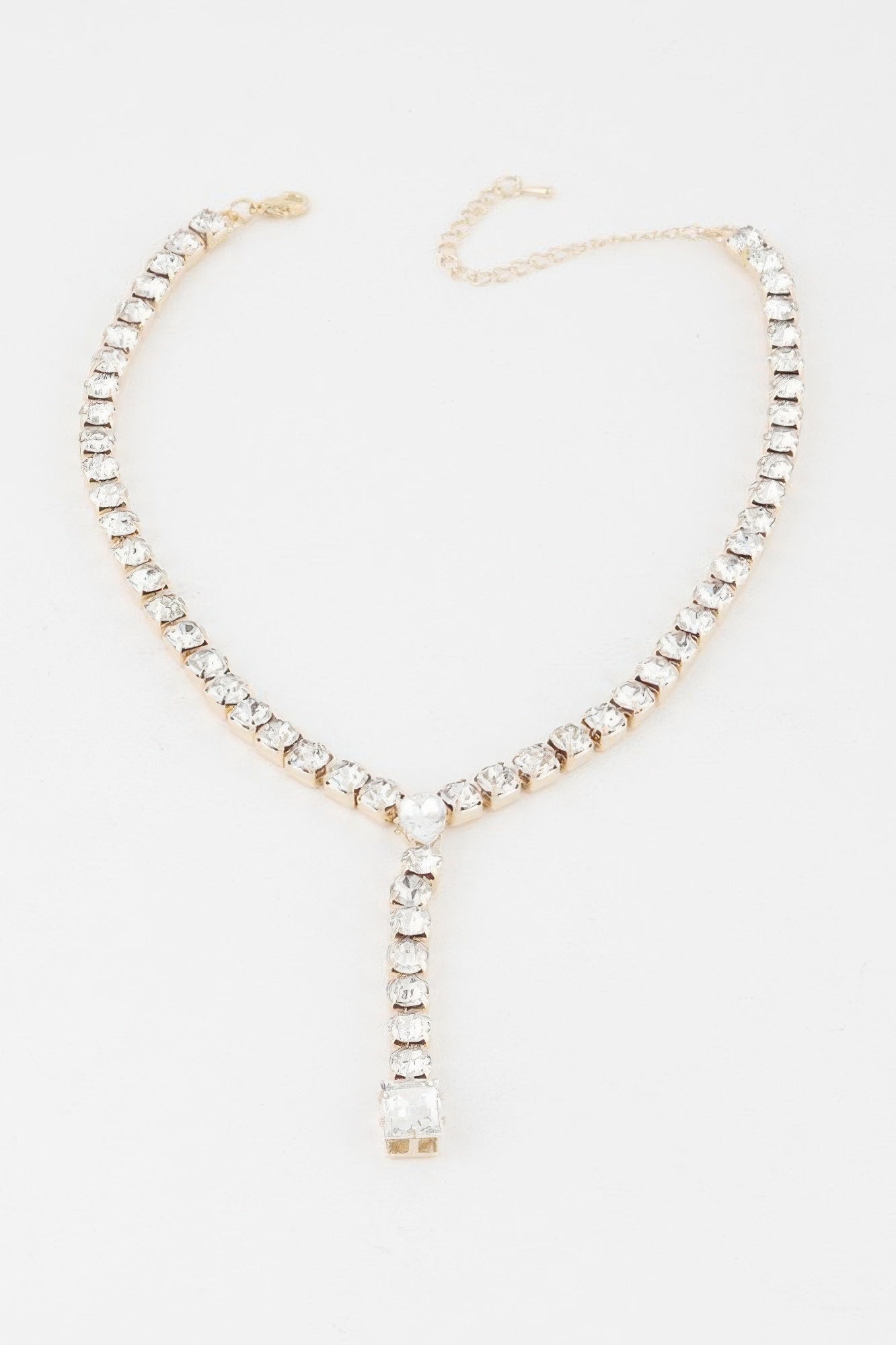 Golden Heir Dipped In Fancy Y Necklace featuring a gold chain with clear and gold accents, stylish and elegant jewelry piece.