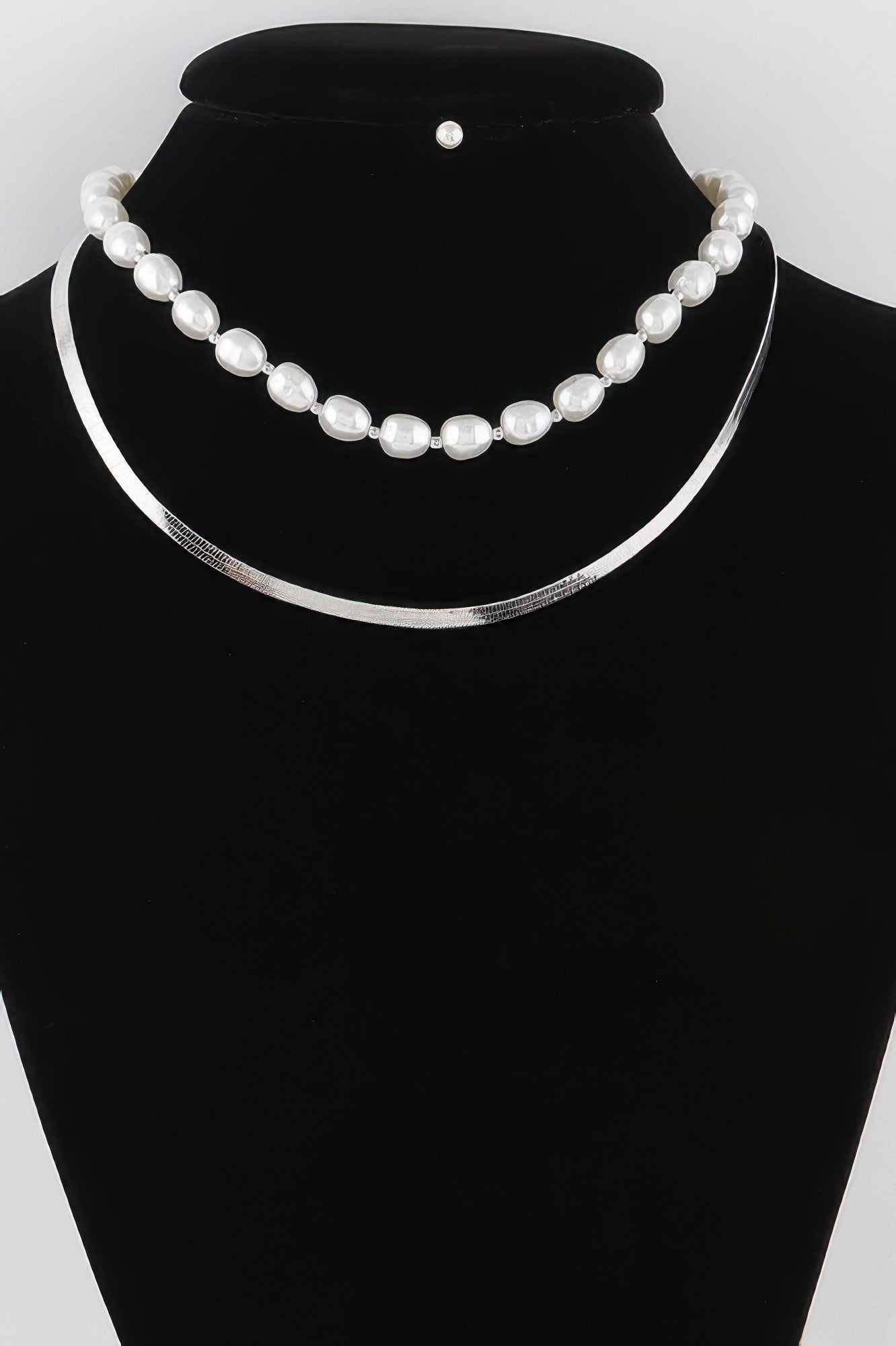 Golden Heir stone snake chain necklace in gold with cream accents, showcasing a sleek and elegant jewelry design.