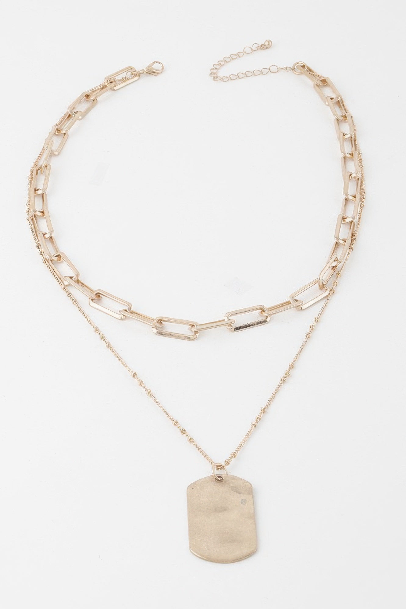 Golden Heir double layered gold tag chain necklace with sleek, stylish design, showcasing layered pendant details.