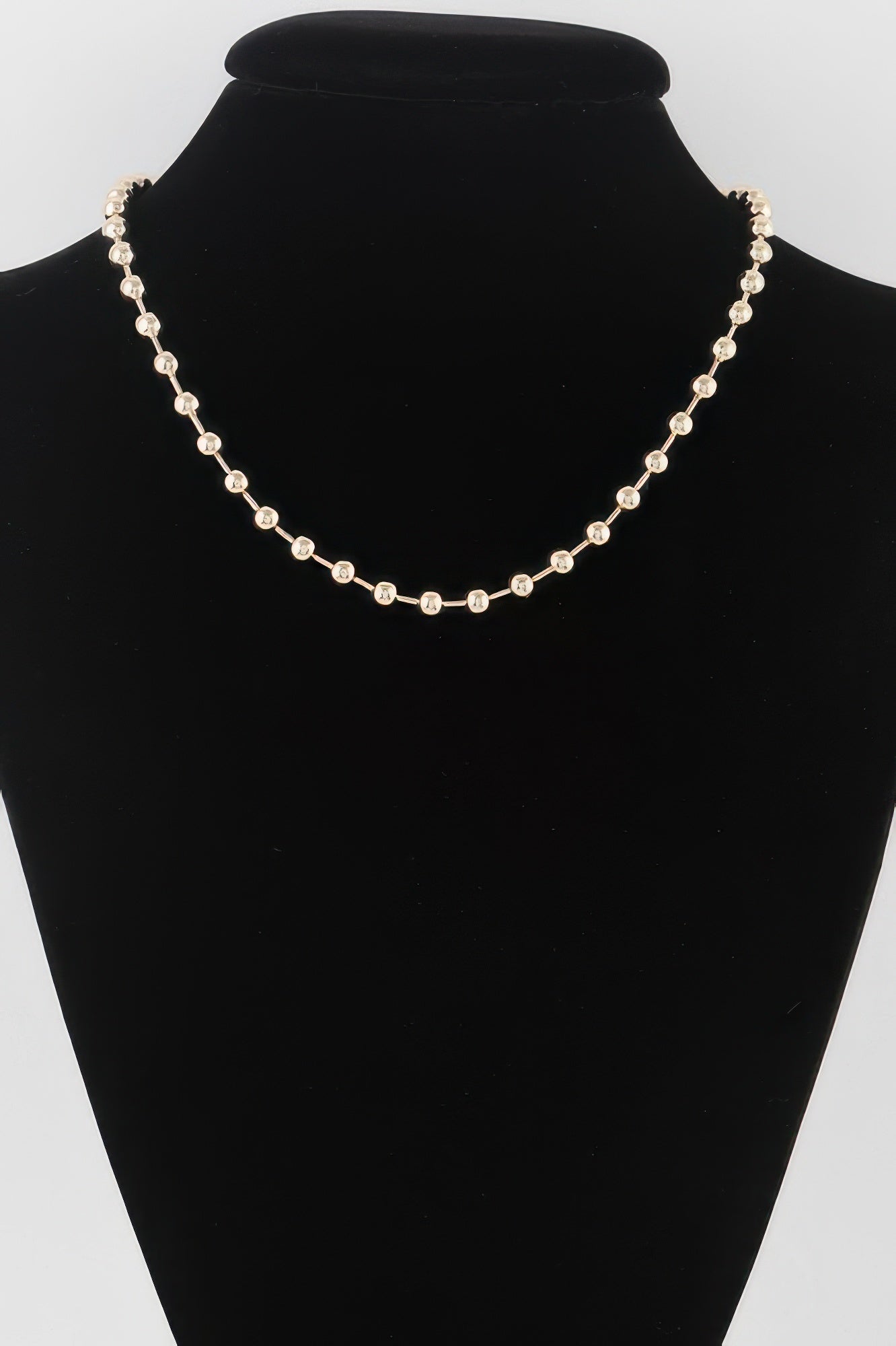 Golden Heir metal ball beaded short necklace with gold-toned beads, stylish and elegant jewelry accessory.
