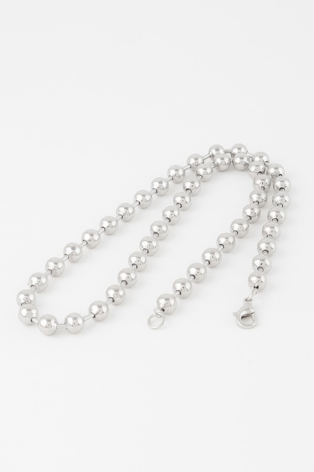 Golden Heir metal ball beaded short necklace featuring gold-toned beads, stylish and eye-catching jewelry accessory.