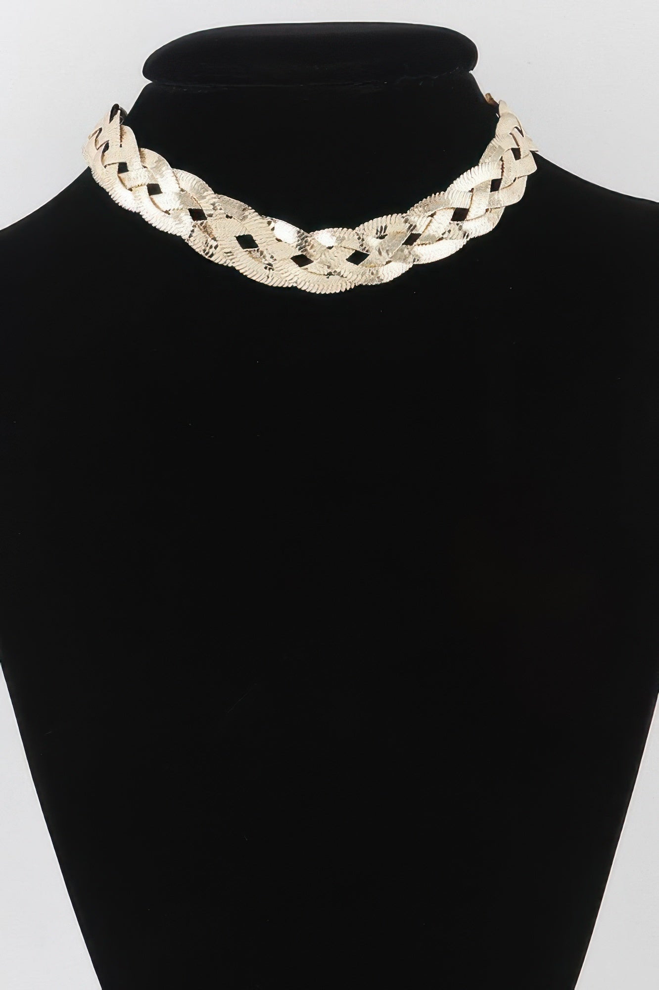 Golden Heir triple braid snake chain necklace in shiny gold finish, showcasing its intricate braided design and sleek appearance.