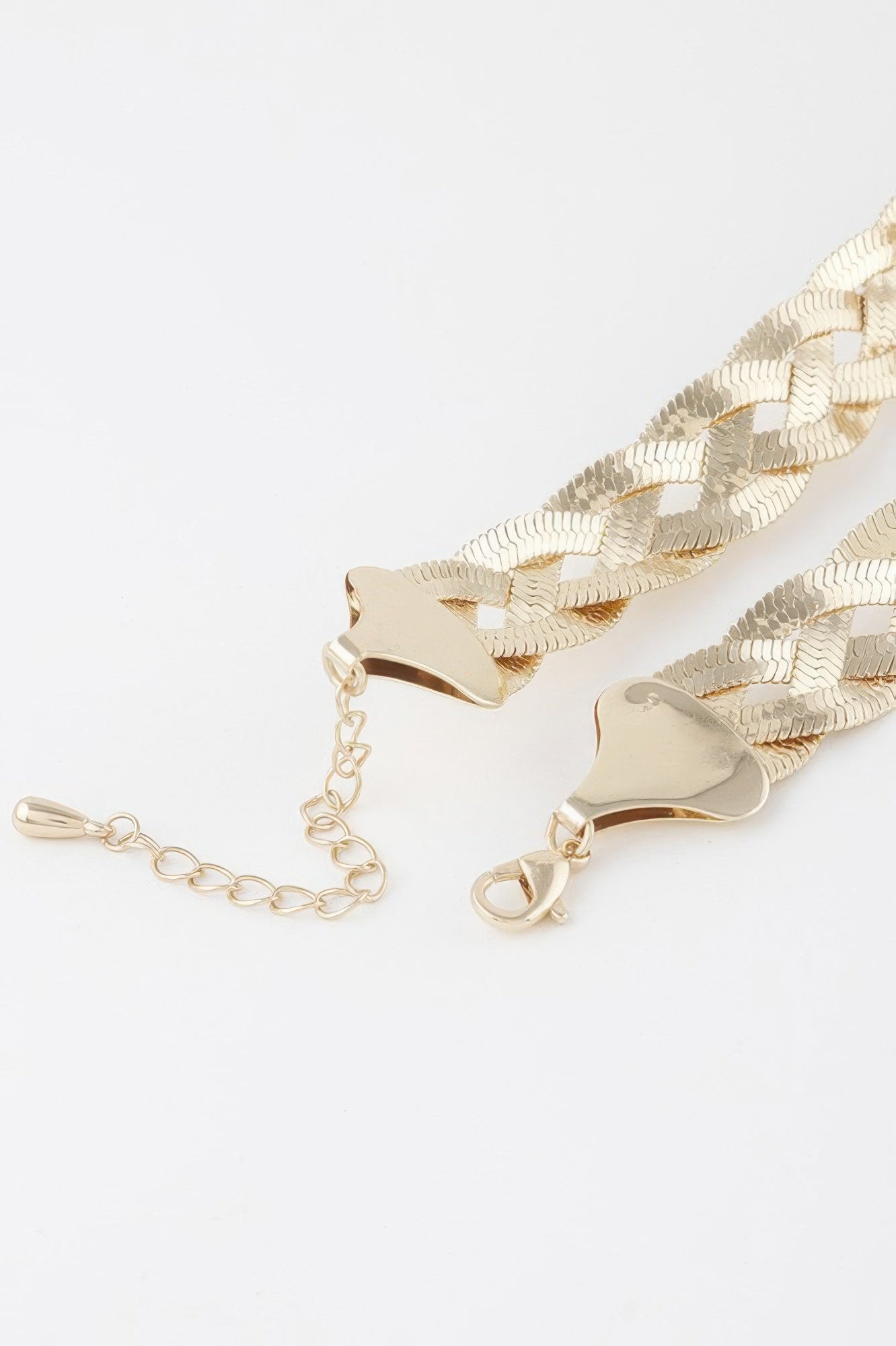 Golden Heir triple braid snake chain necklace in shiny gold, showcasing its intricate braided design and smooth finish.
